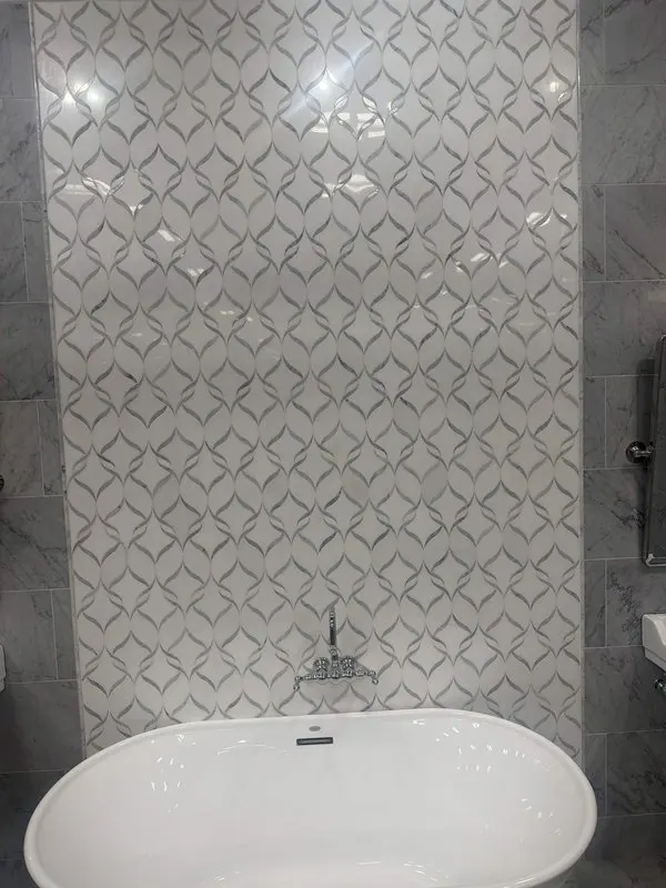 Decorative ogee-pattern tile bathroom with freestanding tub, Jacksonville FL